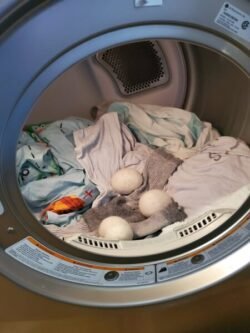 Do Dryer Balls Work? | Just a Small Change wool dryer balls mixed in with cloths in dryer